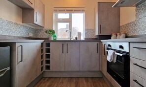 Coffee/tea maker, fridge, microwave, oven