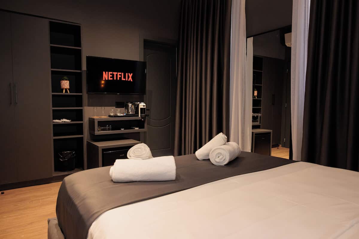 Desk, laptop workspace, blackout drapes, soundproofing