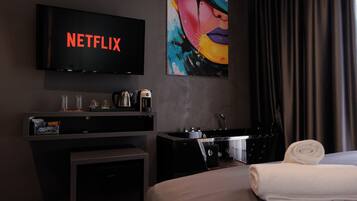 Deluxe Suite, City View | 1 bedroom, desk, blackout drapes, soundproofing