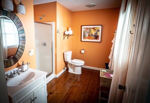 Shower, eco-friendly toiletries, towels, toilet paper