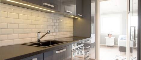 Fridge, oven, coffee/tea maker, toaster