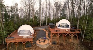 Two dome-shaped cabins with wooden decks, surrounded by a forest. - Contrast Cove Dome in Smoky Mountains - GlampiTiN
(Hartford)