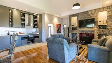 Family Villa, Slope side | Living area | 55-inch Smart TV with digital channels, fireplace, Netflix