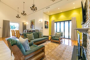 Presidential Villa, Garden View | Living area | 55-inch Smart TV with digital channels, fireplace, Netflix - Bali and Eva Midlands (Zenzani)