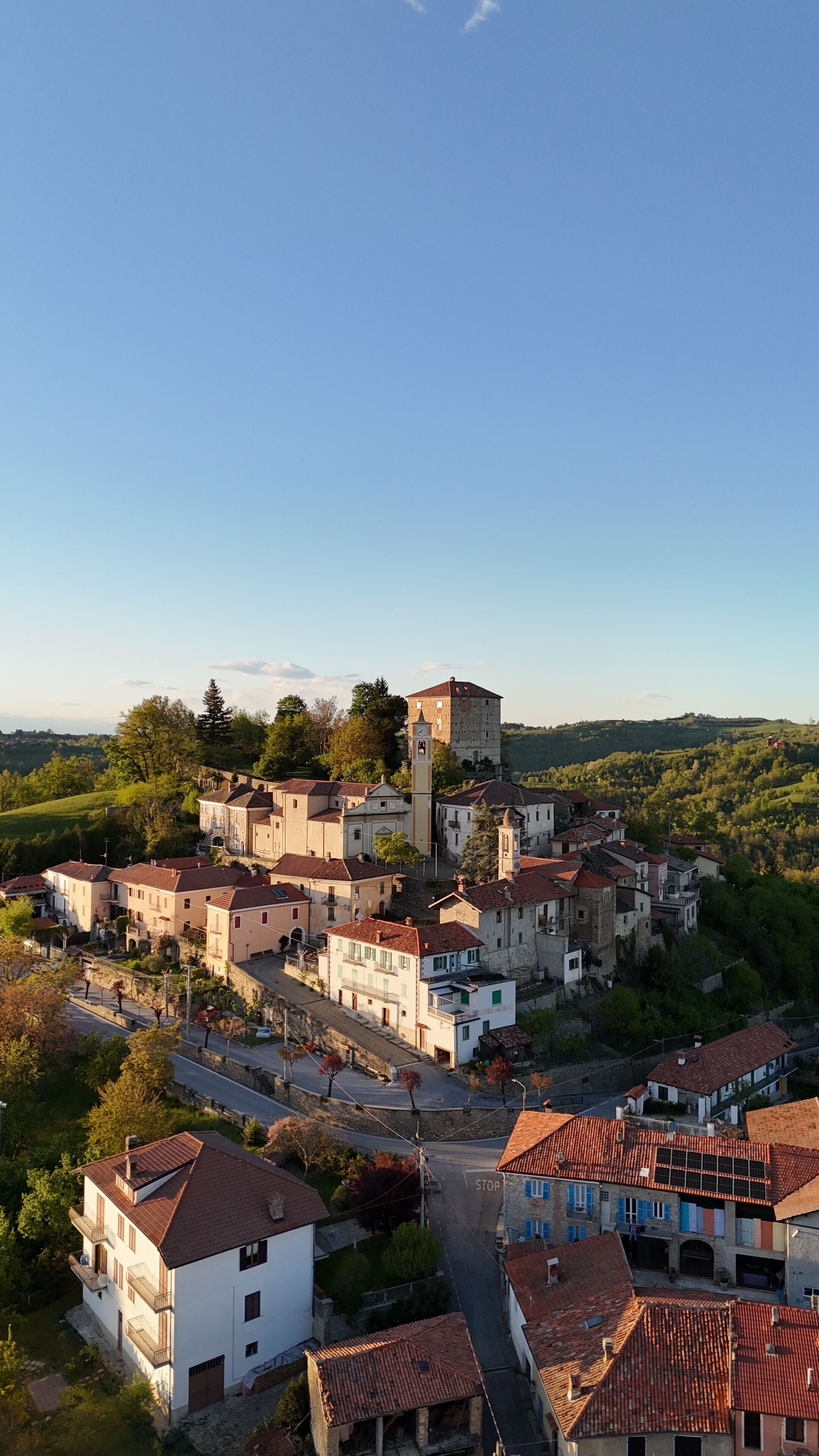 A historic town with a prominent tower, narrow streets, and traditional architecture.