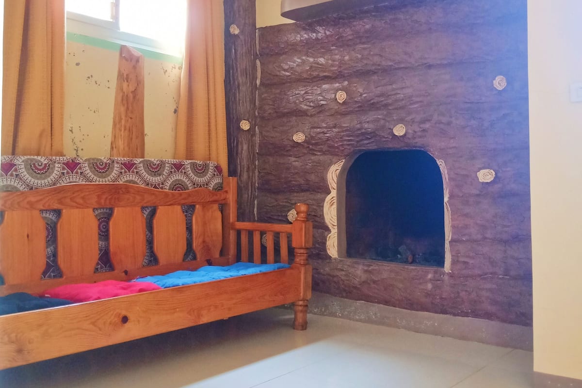 Habitación cuádruple exclusiva, vista a la montaña | Área de sala de estar