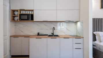 Departamento, vista a la ciudad | Cocina privada | Tetera eléctrica