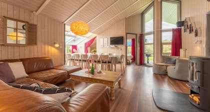 12 person family holiday home with sauna, whirlpool, two showers and toilets, wood-burning stove and canoe in 1st row to the lake with wonderful lake view in Otterndorf