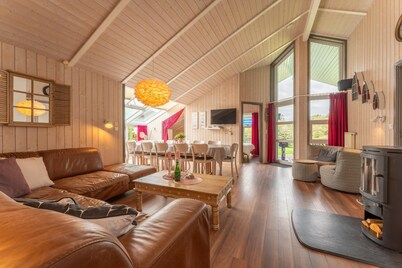 12 person family holiday home with sauna, whirlpool, two showers and toilets, wood-burning stove and canoe in 1st row to the lake with wonderful lake view in Otterndorf