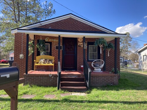 Updated bungalow with screened in porch  in rear.