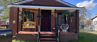 Updated bungalow with screened in porch  in rear.
