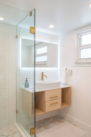 Shower, hair dryer, towels, soap