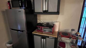 Microwave, coffee/tea maker, toaster, cookware/dishes/utensils