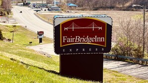 A sign for FairBridgelln Express, featuring a prominent logo and the name of the establishment.