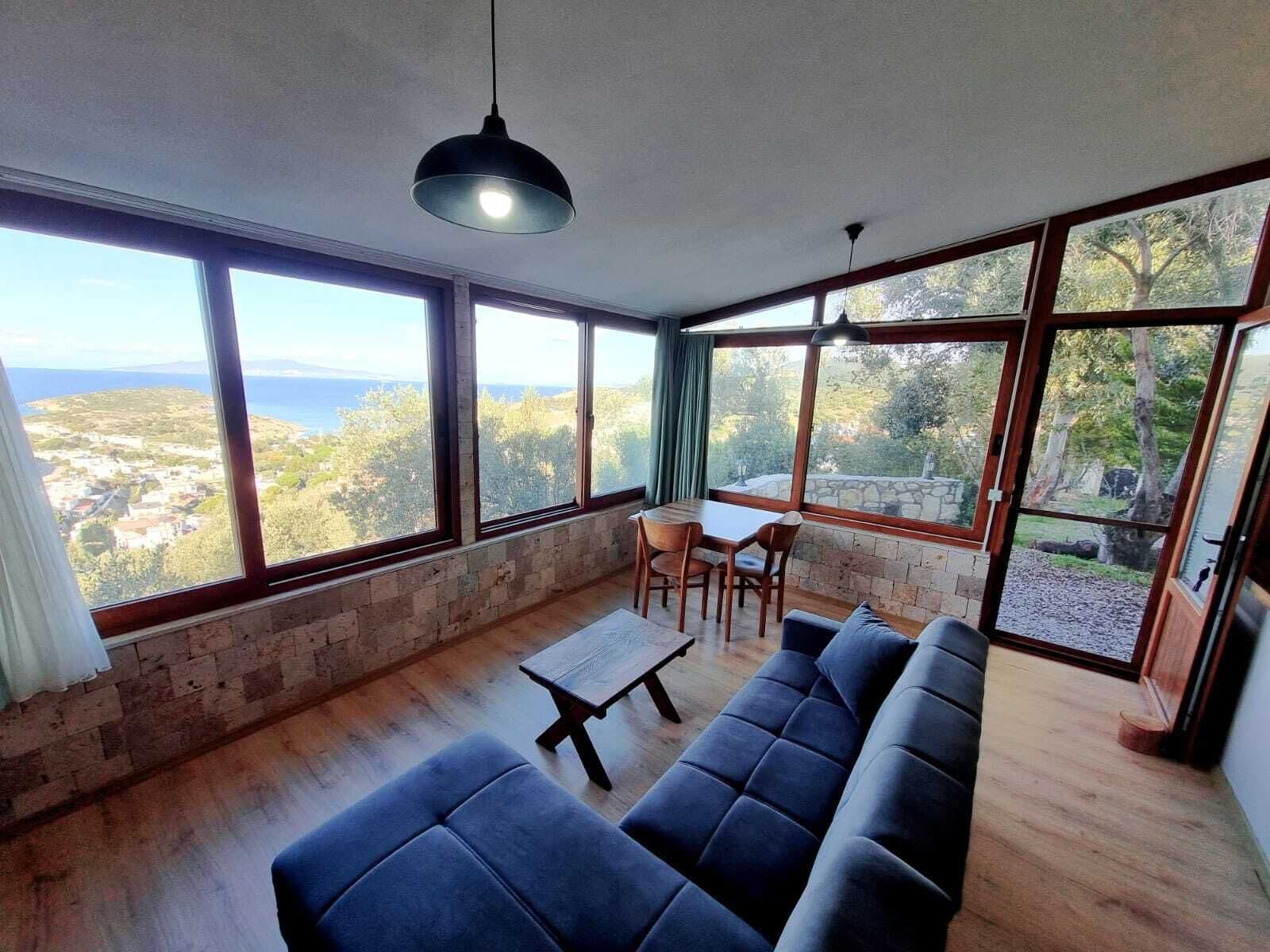 Panoramic Studio, 1 Queen Bed with Sofa bed, Sea View, Mountainside | Living area