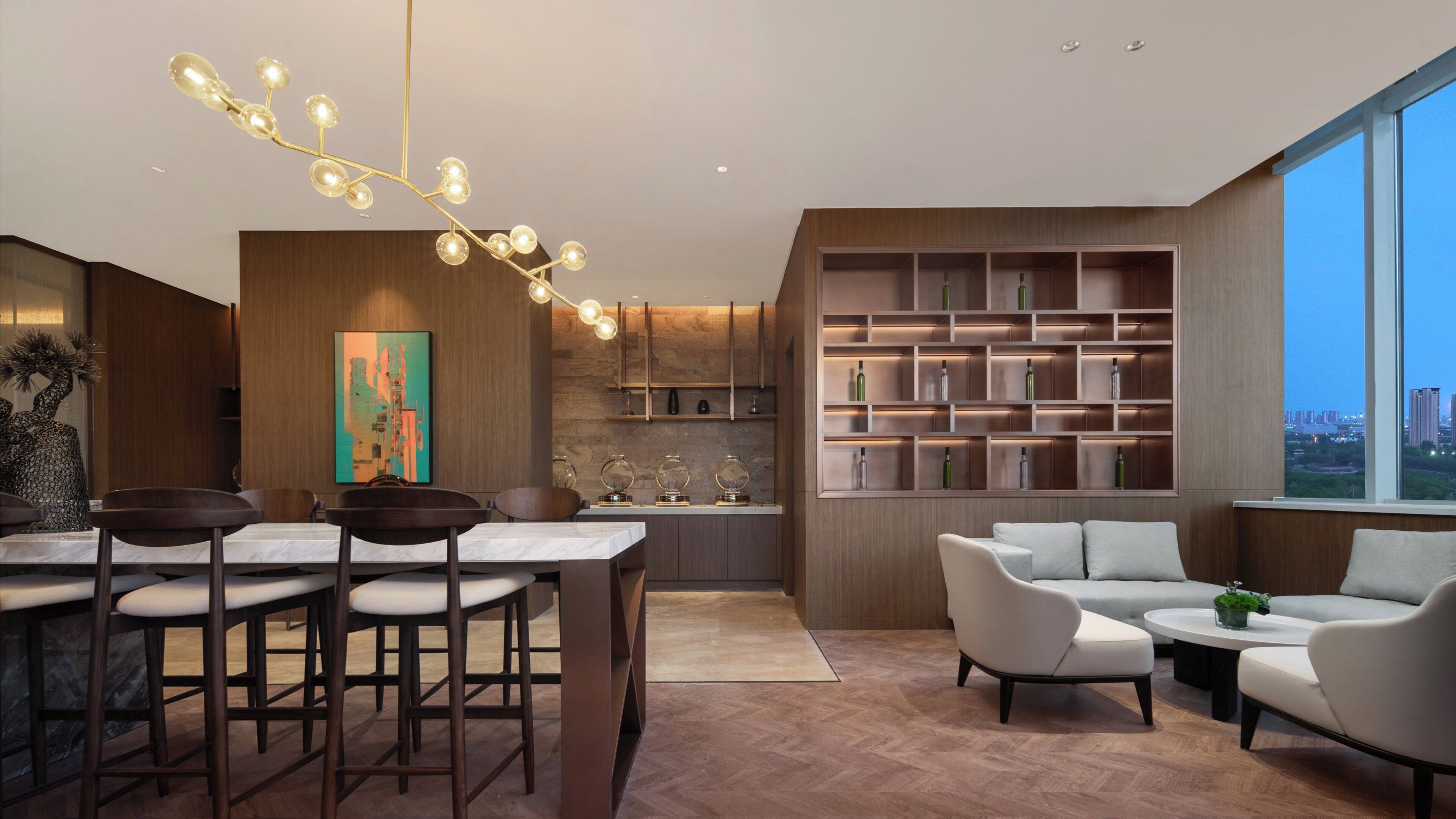 A modern interior with a dining area, kitchen, and seating space.