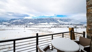 A snow-covered outdoor seating area with a view of snow-covered mountains. - Adventure Awaits at R202 | Ridge Haven in Eden, UT! (Eden)