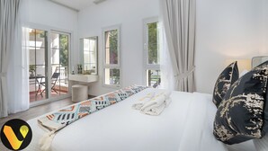 A bedroom with a large bed, a bedside table, a mirror, and a view of the outdoors through large windows. - Vogue | Springs Villa Emirates Hills close to Mall of the Emirates | Ski Dubai (Dubai)