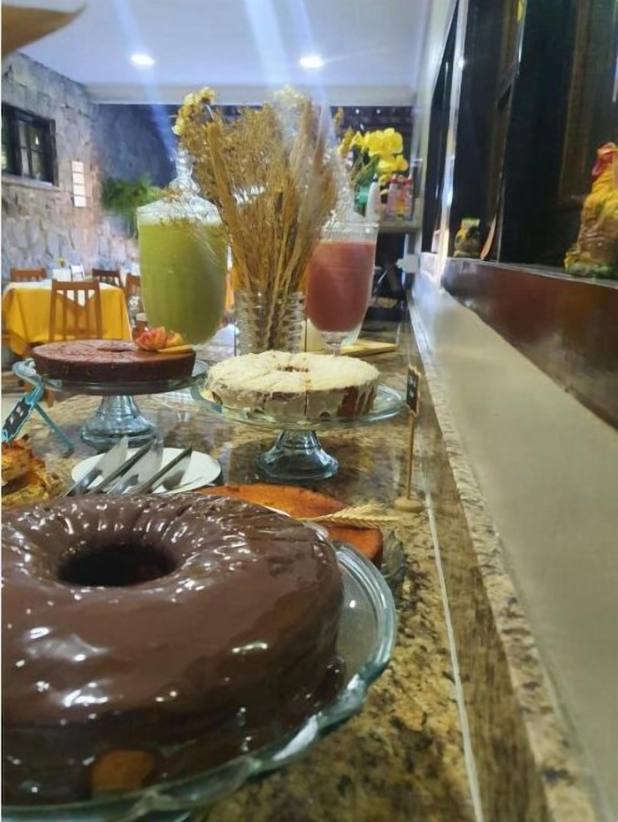 A buffet setup with various food items and drinks.