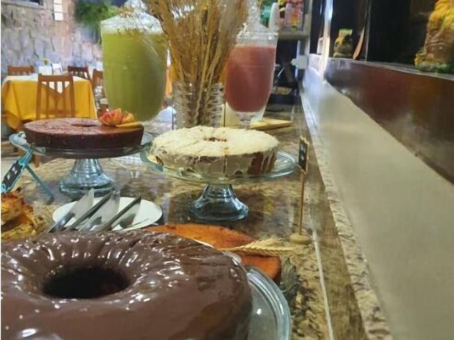 A buffet setup with various food items and drinks.