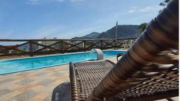 Outdoor pool, open 9:30 AM to 10:00 PM, pool umbrellas, sun loungers