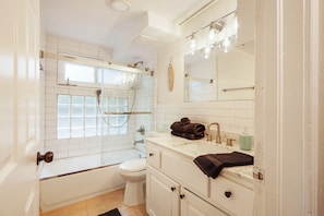 Shower, hair dryer, towels, soap