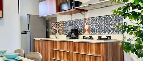 Fridge, microwave, stovetop, coffee/tea maker