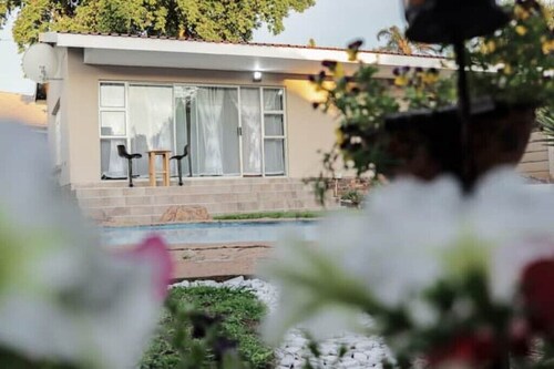 Elegant Poolside Retreat: 2-Bed Luxury Guesthouse
