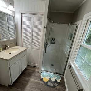 Shower, hair dryer, towels, soap