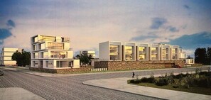 A modern multi-story building with a flat roof, large windows, and a stone base. - Apartamento a Estrenar, Céntrico, Cerca de Playa Grande. Cochera. Equipado Full (Cautin)