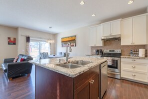 Fridge, microwave, oven, stovetop - 3-Bedroom Retreat Close to the Mountains & Airport (Calgary)