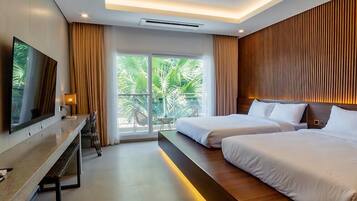 Deluxe Room, 2 Queen Beds | Laptop workspace, free WiFi