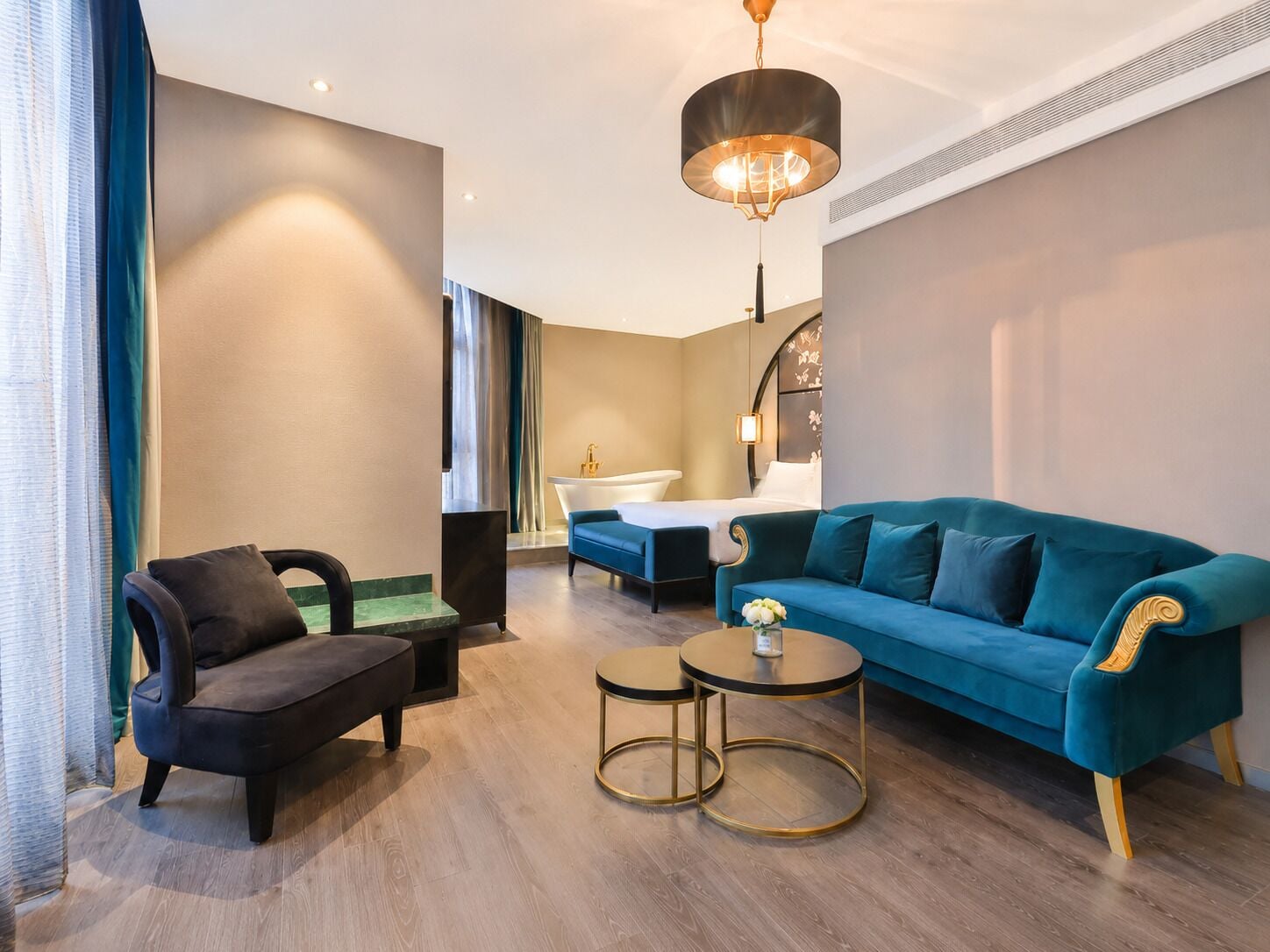 Luxury Suite | Living area | 55-inch TV with digital channels