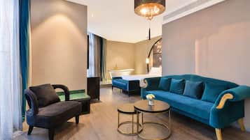 Luxury Suite | Living area | 55-inch TV with digital channels