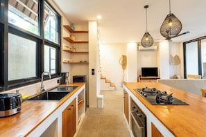 Villa | Private kitchen | Fridge, oven, coffee/tea maker, coffee grinder