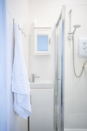 Shower, towels, soap, shampoo