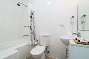 Combined shower/bathtub, hair dryer, towels, soap