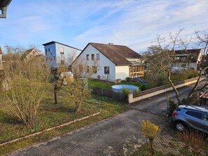 A residential area with houses, a playground, and a swimming pool.