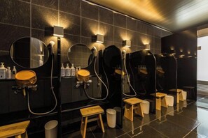A public restroom with multiple sinks, mirrors, and hand dryers. - Super Hotel Premier Hakataeki (Fukuoka)