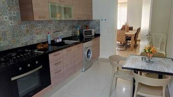 Fridge, microwave, stovetop, cookware/dishes/utensils