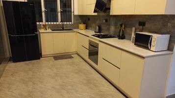 Luxury Villa | Private kitchen | Fridge, microwave, oven, electric kettle