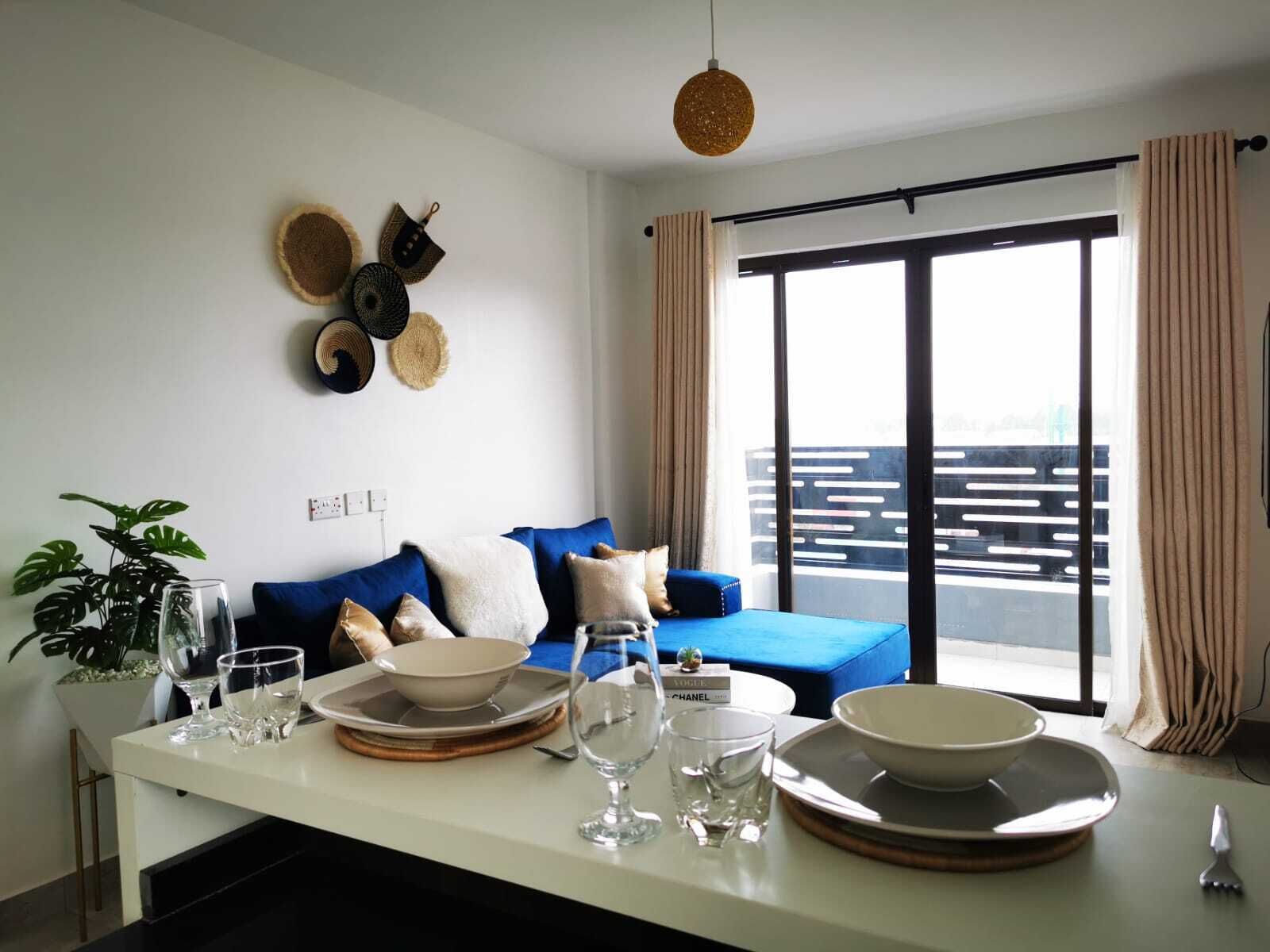 Business-Apartment | Wohnbereich | 34-Zoll-Smart-TV mit Digitalempfang