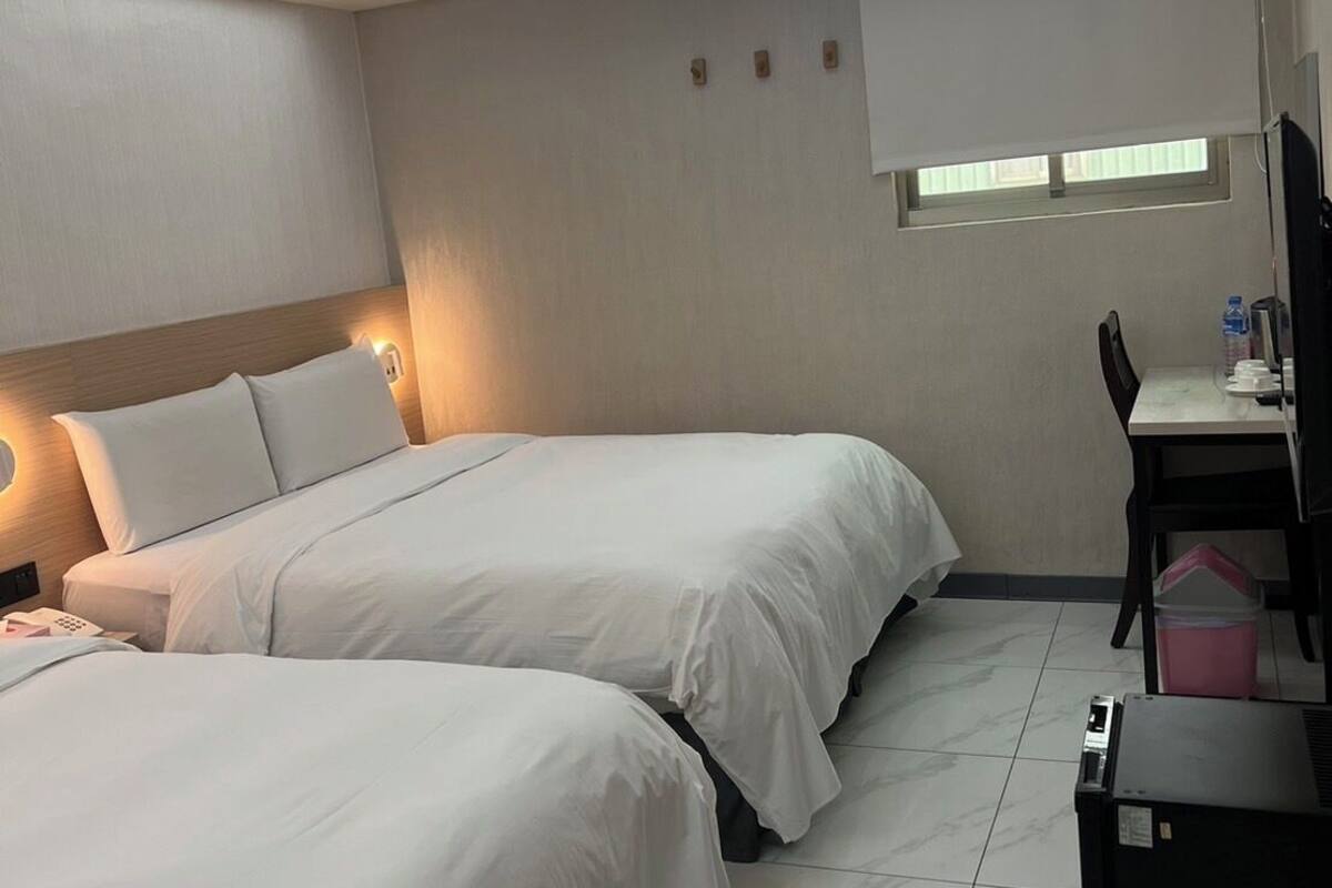 Family Room | Premium bedding, down comforters, desk, blackout drapes