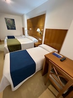 Classic Quadruple Room, City View | Desk, soundproofing, free WiFi