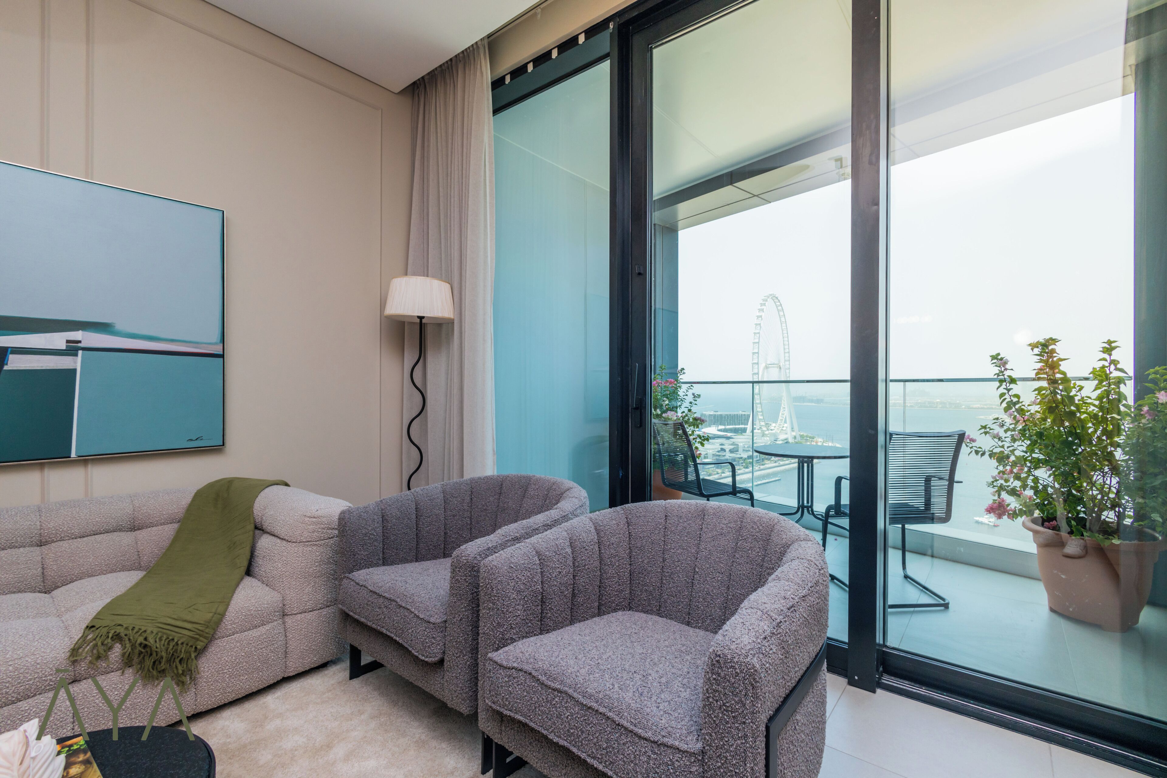 A modern living room with a sofa, two armchairs, a lamp, and a large window with a view of a Ferris wheel.