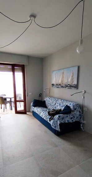 Departamento, vista a la playa | Área de sala de estar | Televisión LED 