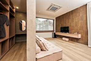 Family Room 1 | Living area | 40-inch flat-screen TV with satellite channels, DVD player - Baan Rai Santisuk (Lom Sak)