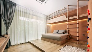 A modern bedroom with a bunk bed, a wooden ladder, a ball pit, and a large window with sheer curtains. - Baan Rai Santisuk (Lom Sak)