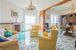 Basic Apartment | Living area | 20-inch TV with cable channels - Sea Inside (Amalfi)