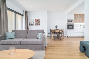 Two-Bedroom Family Apartment with Terrace | Living area | 50-inch flat-screen TV with cable channels - Limehome Barcelona Plaça Pirineus (L'Hospitalet de Llobregat)